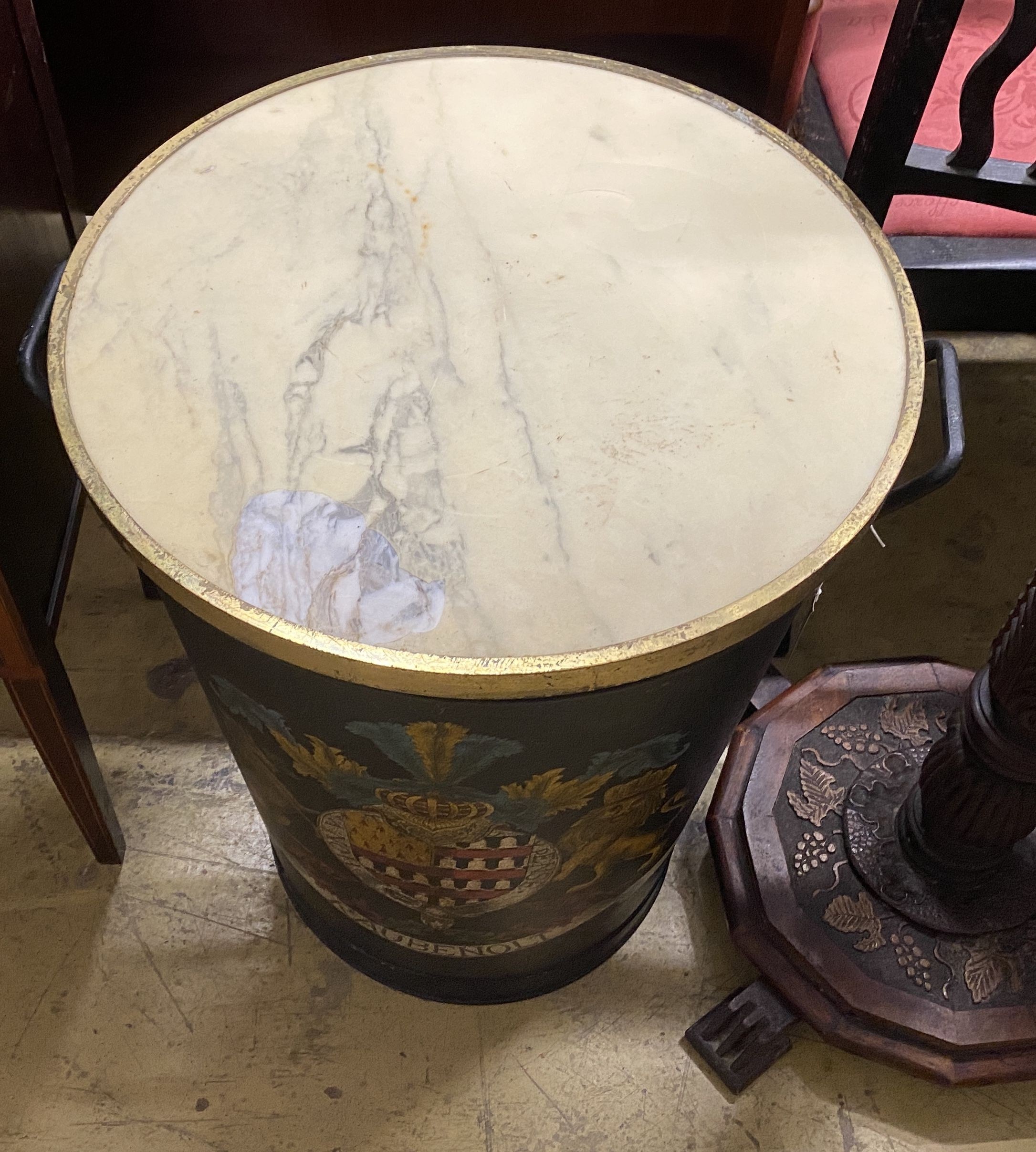 A marble topped painted metal bin decorated with an armorial, diameter 51cm, height 65cm